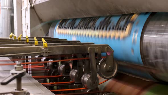 Conveyor line for the production of cardboard boxes. Machine carves cardboard boxes from sheets .