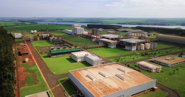 Plant of an industry in the middle of green vegetation.