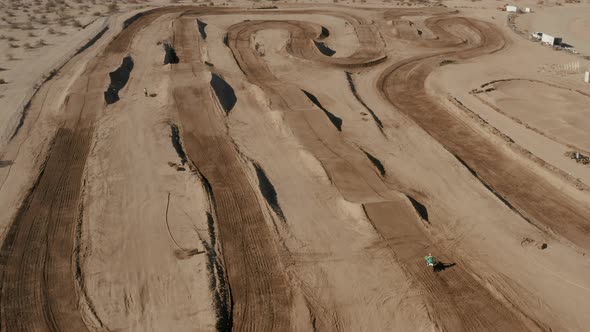 Motocross rider on offroad circuit, California Mojave Desert, High Aerial View