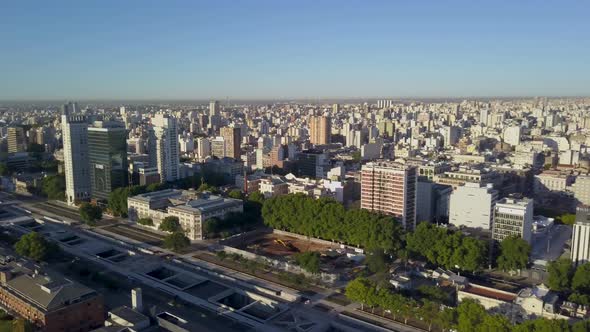 Aerial half turn panning of Buenos Aires city just after sunrise