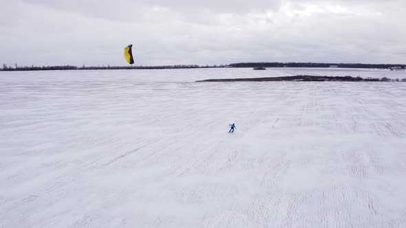 SnowKiting Kitesurfing Sport on the Ice Lake Winter