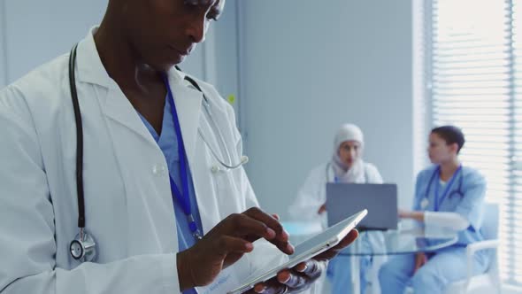 Close-up of African American male doctor using digital tablet in hospital