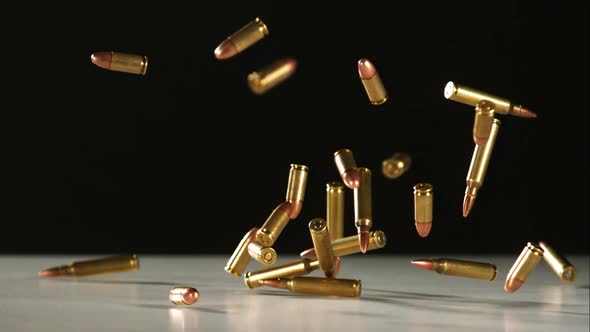 Bullets falling bouncing in ultra slow motion 1500fps on a reflective surface - BULLETS PHANTOM 