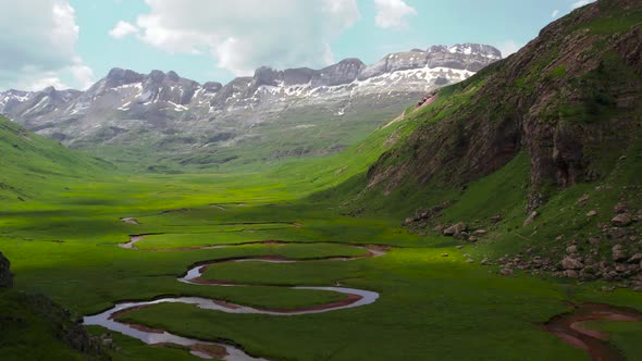Curved river in mountainous valley