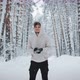 Young Guy Play Snowballs in the Winter Forest - VideoHive Item for Sale