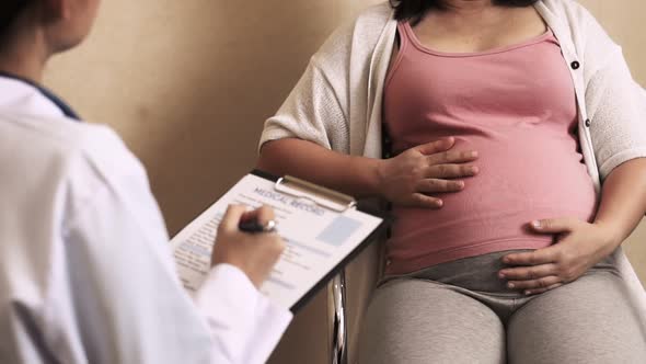 Pregnant Woman and Gynecologist Doctor at Hospital