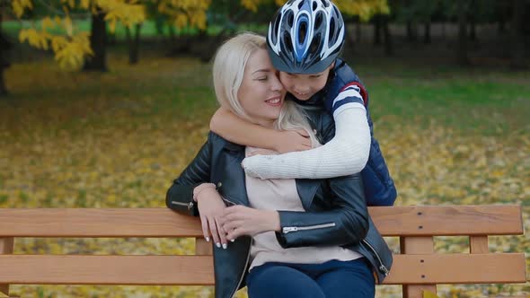 Little Boy Embrace His Mother