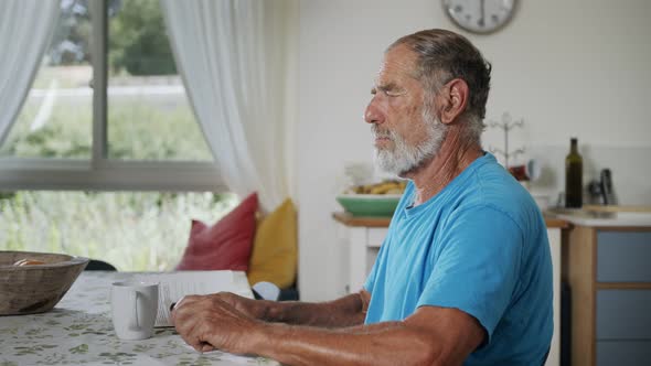 Man with Parkinson's disease using medical Cannabis in vaporizer to stop shaking