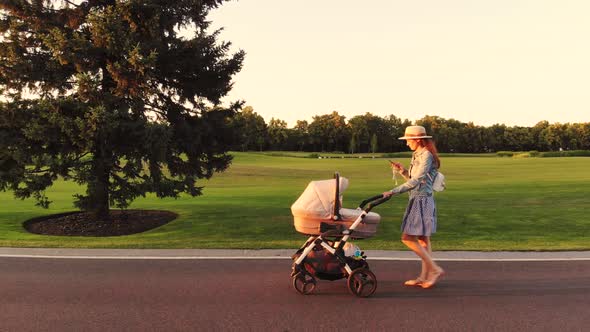 Mother with Baby Carriage