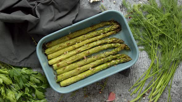 Roasted Asparagus Seasoned with Salt, Pepper, Garlic and Decorated with Fresh Herbs