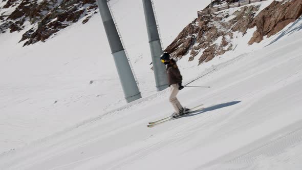Woman Skiing Downhill Slope