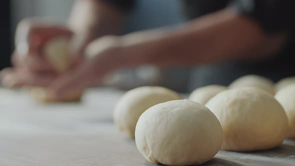 Uncooked Buns on Table