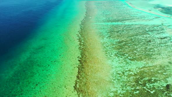 Aerial view seascape of tropical bay beach trip by shallow ocean with bright sandy background of adv