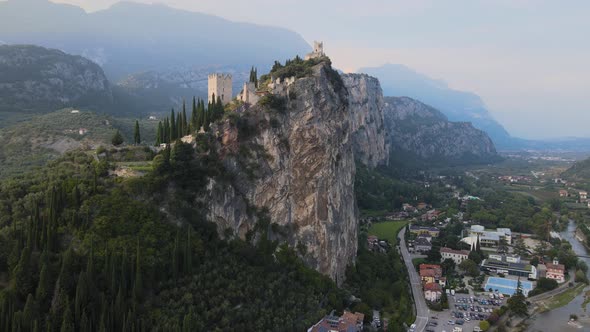 Aerial view, Castello di Arco, medieval castle on steep cliff in Riva Del Garda city, Trentino, Ital