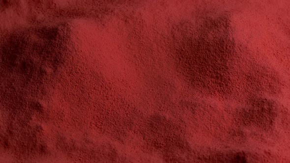 Red Powdered Material Rotating