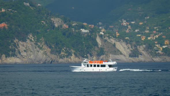 A ferry tender taxi boat taking passengers back to a cruise ship in the Mediterranean.