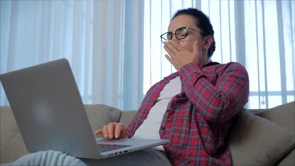 Freelancer Concerned Caucasian Woman Working on a Laptop,tired,closing Rubs Her Eyes From Fatigue