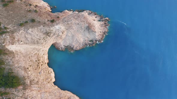 Aerial Topdown View of White Rock and Blue Sea Near Assos Kefalonia Greece