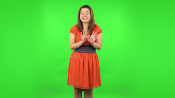 Cute Girl Strictly Gesturing with Hands Shape Meaning Denial Saying NO. Green Screen