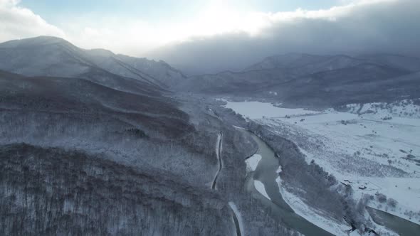 Aerial View of Plateau LagoNaki Mountain Twisted Road in the Winter and Driving Car