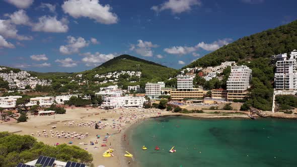 Aerial footage of the Spanish island of Ibiza showing the beautiful beach front and hotels