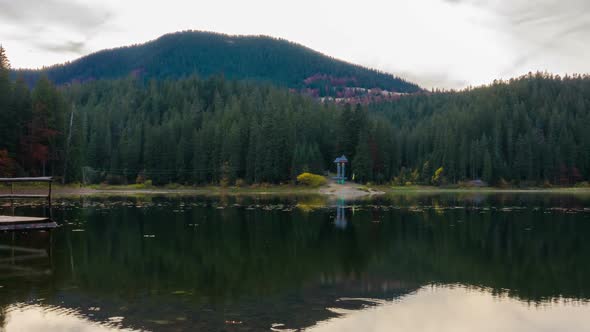 Autumn Sunset at Mountain Lake with Colorful Trees in the Forest