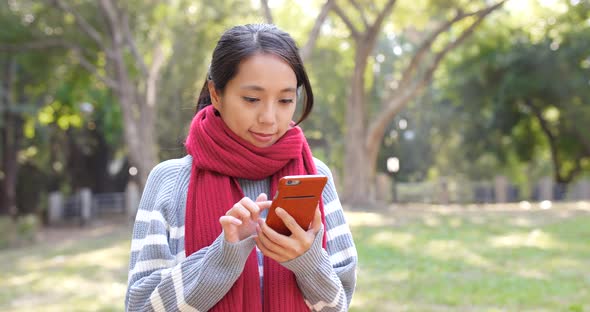 Woman use of smart phone in city