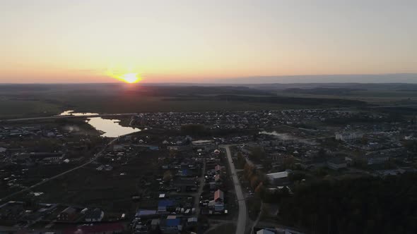 Aerial view of autumn village, evening, sunset 03