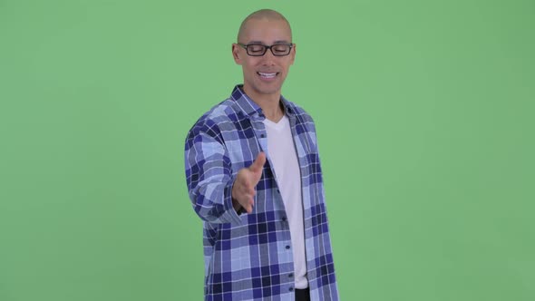 Happy Bald Hipster Man Giving Handshake