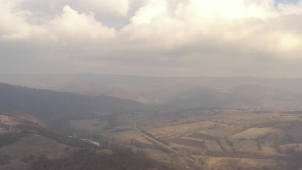 Polluted air over the valley 4K aerial footage