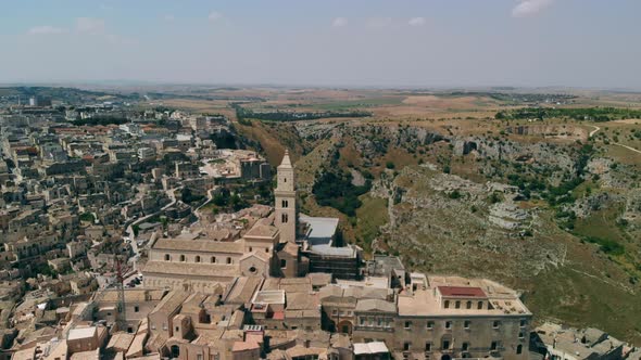 View of Ancient Town of Matera Sassi Di Matera in Sunny Day, Drone Shot