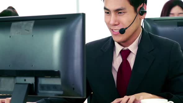 Business People Wearing Headset Working in Office