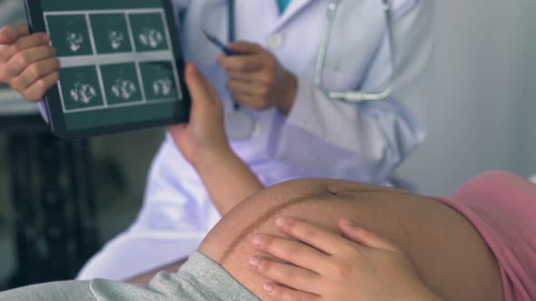 Pregnant Woman and Gynecologist Doctor at Hospital