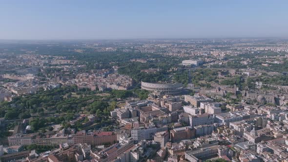 Wide aerial rotating shot of the Colosseum in Rome, Italy.