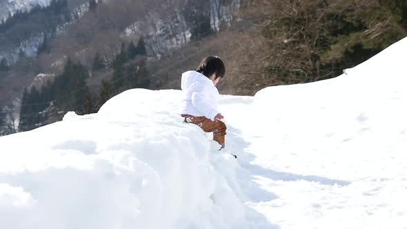 Cute Asian Child Playing Snow Outdoors Slow Motion