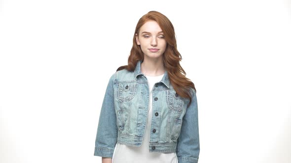 Happy Caucasian Woman in Denim Shirt Showing Ok Sign and Looking at the Camera Over White Background