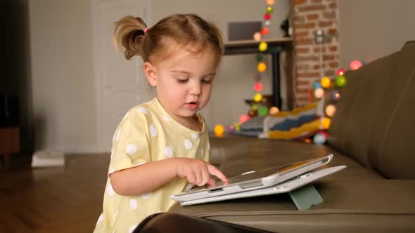 Toddler Using Tablet at Home