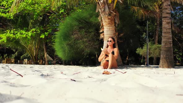 Female models tan on marine island beach lifestyle by blue sea with white sandy background of Koh Ph