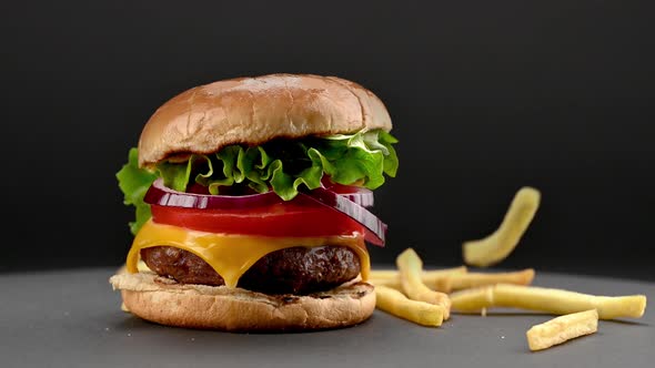 Beef burger with falling french fries