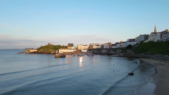 Tenby village and beach at golden hour, Pembrokeshire in Whales. Aerial panoramic view
