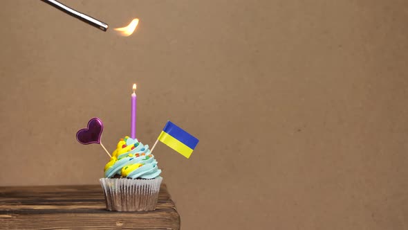 Cupcake with Ukrainian Flag for Birthday with Candles and Decorations