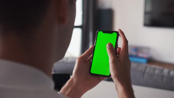 Human Arms Hold Electronics Gadget with Chromakey Touchpad Closeup. Guy Gesturing: Scrolling App By