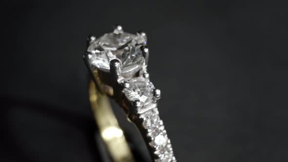 Extreme Detailed of Diamond Ring Close Up Shot While Rotating on Dark Background