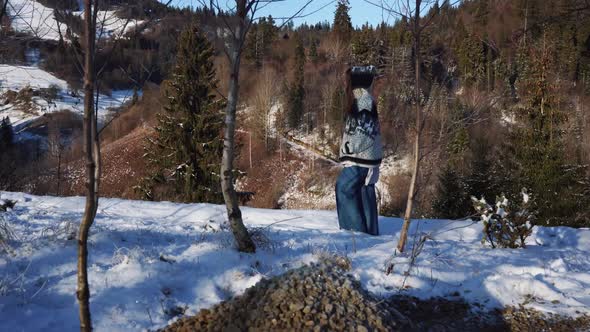 Woman Walking During Winter Time Among Forest