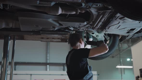 Car on a Lift in a Specialized Service