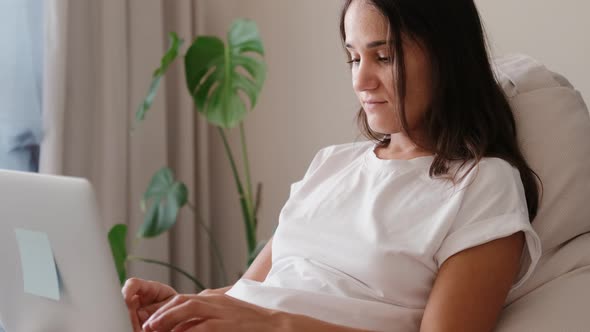 Young Woman Working on Laptop From Home