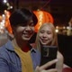 Young Asian couple travel make a video live streaming on social network by smartphone. - VideoHive Item for Sale