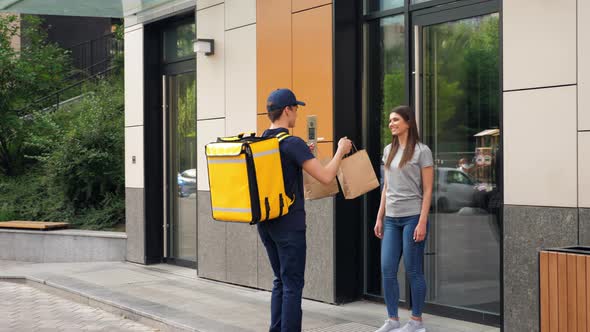 Positive Food Delivery Man Courier with Thermal Backpack Deliver Order Woman