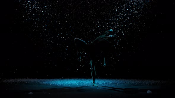 Elements of Modern Ballet Performed By a Sensual Male Dancer. Ballet Dancer Against the Background