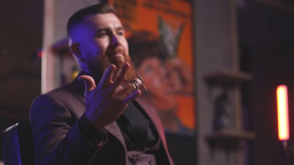 Portrait of Professional Barber Holding Scissors in Hands